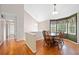 Formal dining room with hardwood floors, decorative lighting, and large windows at 2623 Lone Oak Nw Trl, Kennesaw, GA 30144