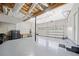 Three car garage with painted floor, storage shelves, and workbench at 2623 Lone Oak Nw Trl, Kennesaw, GA 30144