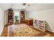 Finished attic space offering versatility and featuring hardwood floors and natural light at 107 W Point Trl, Woodstock, GA 30189
