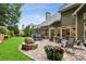 Large backyard with a stone fire pit and paved patio creating an outdoor living space, great for entertaining at 107 W Point Trl, Woodstock, GA 30189