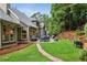 Beautiful backyard with a patio and lush landscaping, perfect for outdoor entertaining and relaxation at 107 W Point Trl, Woodstock, GA 30189