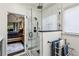 Modern bathroom featuring a glass enclosed shower with dual shower heads and a view to the main bedroom at 107 W Point Trl, Woodstock, GA 30189