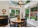 Cozy breakfast nook with views of the private, fenced backyard through multiple windows at 107 W Point Trl, Woodstock, GA 30189