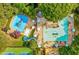 Aerial view of a resort-style community pool area with slides and an adult pool for recreation and relaxation at 107 W Point Trl, Woodstock, GA 30189