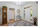Elegant foyer with tile flooring, complemented by a grandfather clock and stylish decor at 107 W Point Trl, Woodstock, GA 30189