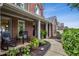 Inviting front porch with rocking chairs and lush greenery, perfect for relaxing outdoors at 107 W Point Trl, Woodstock, GA 30189