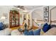 Comfortable living room with hardwood floors, an elegant display cabinet, and view of the staircase at 107 W Point Trl, Woodstock, GA 30189