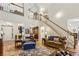 Bright and airy living room with a grand staircase and open layout, perfect for entertaining at 107 W Point Trl, Woodstock, GA 30189