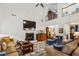 Spacious living room with vaulted ceiling, fireplace, open to an upstairs hall and lots of natural light at 107 W Point Trl, Woodstock, GA 30189