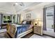 Spacious main bedroom with tray ceiling, sitting area, and large windows overlooking the backyard at 107 W Point Trl, Woodstock, GA 30189