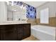 Modern bathroom with double vanity, soaking tub, and decorative floral wallpaper at 2333 Whiteoak Se Bnd, Smyrna, GA 30080