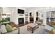 Stylish living room with fireplace, modern furniture, and open floor plan at 2333 Whiteoak Se Bnd, Smyrna, GA 30080