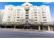 Multi-story residential building in neutral colors on a tree-lined street at 2499 Peachtree Rd # 506, Atlanta, GA 30305