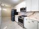 Modern kitchen featuring stainless steel appliances and white cabinets at 2499 Peachtree Rd # 506, Atlanta, GA 30305