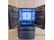 Modern refrigerator with french doors, copper trim, and LED lighting to showcase an elegant kitchen appliance at 2499 Peachtree Rd # 506, Atlanta, GA 30305