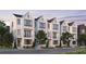 Modern townhomes with white brick, black trim, balconies, and professional landscaping at 2636 Mackintosh Ct # 15, Brookhaven, GA 30319