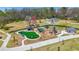 Aerial view of neighborhood playground with lush green space, playground equipment, and covered picnic areas at 2636 Mackintosh Ct # 15, Brookhaven, GA 30319