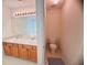 Bathroom vanity featuring dual sinks and a toilet at 5421 Skylar Creek Ln, Buford, GA 30518