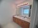 Bathroom vanity featuring dual sinks at 5421 Skylar Creek Ln, Buford, GA 30518