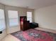 Bedroom showcasing carpet, two windows, and a traditional-style wooden accent piece at 5421 Skylar Creek Ln, Buford, GA 30518