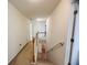 Second floor hallway with doors leading to various rooms at 5421 Skylar Creek Ln, Buford, GA 30518