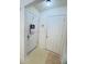 Hallway with doors and neutral walls, providing functionality and style at 5421 Skylar Creek Ln, Buford, GA 30518