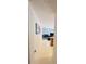 Hallway leading to a living room space, showcasing seamless flow and functional design elements at 5421 Skylar Creek Ln, Buford, GA 30518