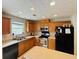 Bright kitchen with stainless steel appliances, plenty of cabinets and a kitchen island for meal prep at 5421 Skylar Creek Ln, Buford, GA 30518