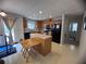 Bright kitchen featuring modern appliances, center island and natural light at 5421 Skylar Creek Ln, Buford, GA 30518