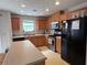Spacious kitchen with stainless steel appliances, cabinets and an island, perfect for cooking and entertaining at 5421 Skylar Creek Ln, Buford, GA 30518