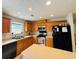 Kitchen featuring ample cabinetry, stainless steel appliances, and an island for food preparation and dining at 5421 Skylar Creek Ln, Buford, GA 30518
