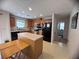 Well-lit kitchen with an island, a window, and modern appliances, including a stainless steel range at 5421 Skylar Creek Ln, Buford, GA 30518