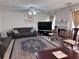 Inviting living room with fireplace, carpet, and comfortable furnishings, ideal for relaxing at 5421 Skylar Creek Ln, Buford, GA 30518