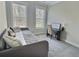 The space includes a comfy daybed, desk, and soft carpet, filled with natural light, creating a peaceful atmosphere at 1952 Azalea Dr, Lawrenceville, GA 30043