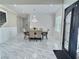 Elegant foyer with marble flooring, ornamental front door, and decorative wall paneling at 1952 Azalea Dr, Lawrenceville, GA 30043