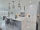 Bright kitchen with island seating offers pendant lights, and open access to the dining area at 1952 Azalea Dr, Lawrenceville, GA 30043