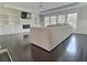 Bright living room with hardwood floors, large windows, and a modern fireplace surrounded by built-in shelves at 1952 Azalea Dr, Lawrenceville, GA 30043