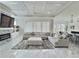 Spacious living room offers a cozy fireplace, large sectional sofa, and coffered ceilings at 1952 Azalea Dr, Lawrenceville, GA 30043