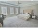Spacious main bedroom with plush carpet, tray ceilings, and lots of natural light at 1952 Azalea Dr, Lawrenceville, GA 30043