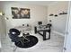 Modern office space with a glass desk, marble floors, and stylish decor at 1952 Azalea Dr, Lawrenceville, GA 30043