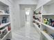 Walk-in pantry with built-in shelving offers ample storage and organization for all your groceries at 1952 Azalea Dr, Lawrenceville, GA 30043