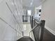 Staircase featuring modern black metal railings and decorative wainscoting at 1952 Azalea Dr, Lawrenceville, GA 30043