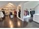 A huge walk-in closet with custom organizers, a mirror, and hardwood floors at 1952 Azalea Dr, Lawrenceville, GA 30043