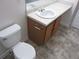 Bathroom showcases a toilet and vanity area with modern fixtures and neutral finishes at 215 Silver Spring St, Dallas, GA 30157