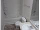 Bathroom features a large soaking tub with shower, modern fixtures, and a vanity at 215 Silver Spring St, Dallas, GA 30157