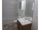 Clean bathroom featuring a vanity, toilet, and shower/tub combination at 215 Silver Spring St, Dallas, GA 30157