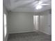 Spacious bedroom featuring plush carpet, neutral paint, and a tray ceiling with fan at 215 Silver Spring St, Dallas, GA 30157