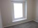 Bright bedroom with carpeted flooring and a window seat for relaxation at 215 Silver Spring St, Dallas, GA 30157