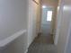 Upstairs hallway with carpet and access to bedrooms and closets at 215 Silver Spring St, Dallas, GA 30157
