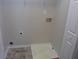 Laundry room setup with tile floors and hookups for a washer and dryer at 215 Silver Spring St, Dallas, GA 30157